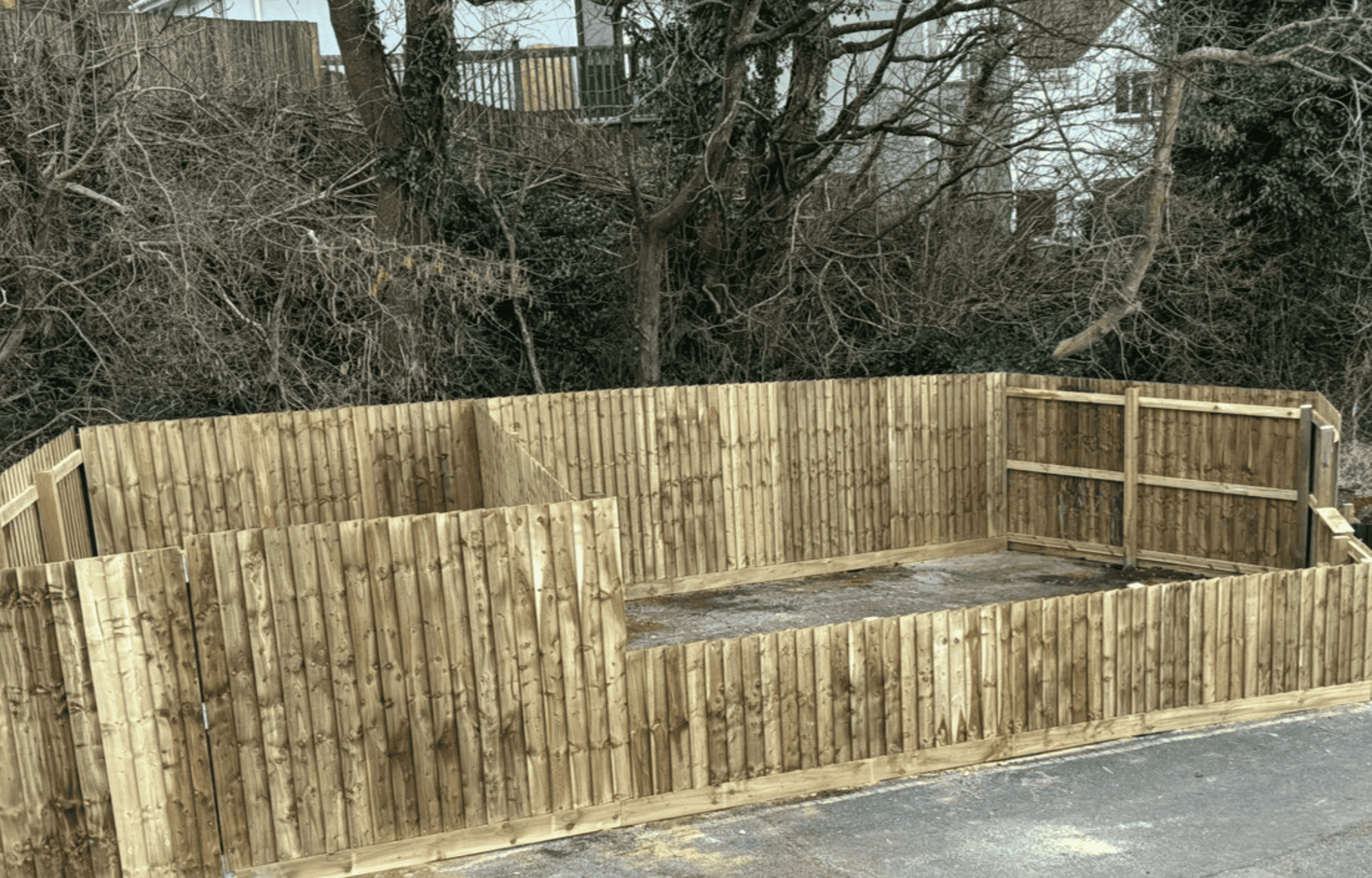 Wooden fencing panel with natural finish, ideal for garden boundary fencing.