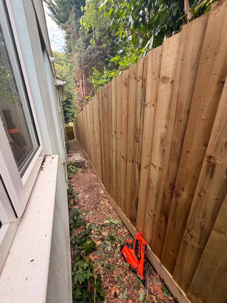 Freshly installed wooden garden fence in Devon for privacy and security.