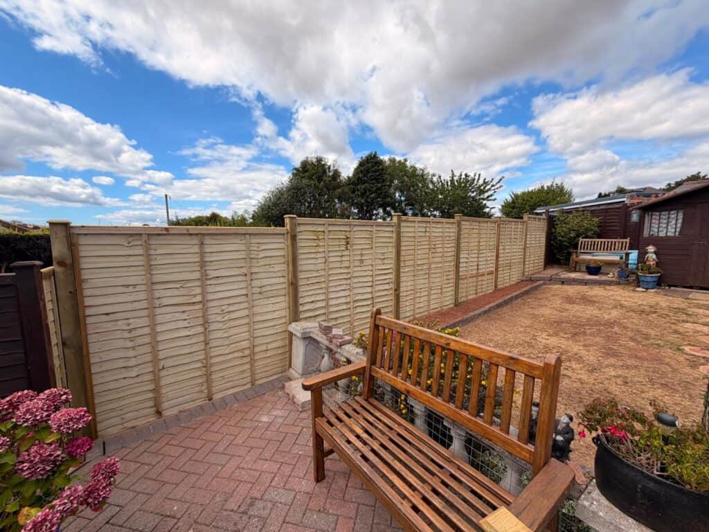 New wooden garden fence installed in Devon for privacy and security.