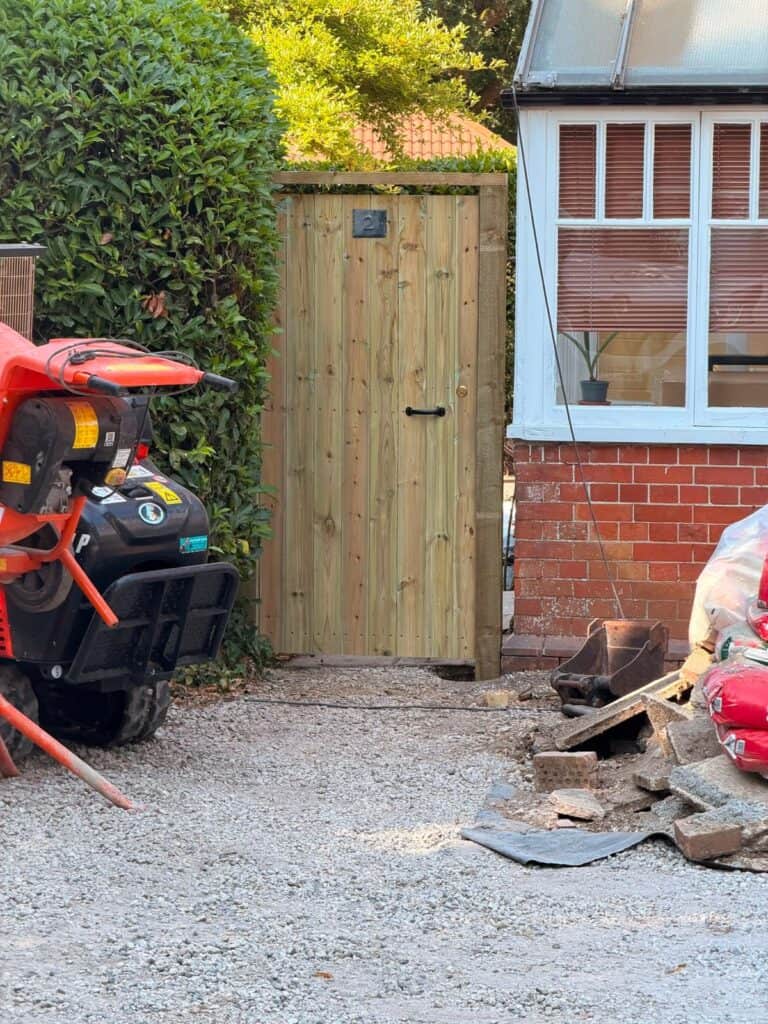 New wooden garden gate installed in Devon for secure boundary.
